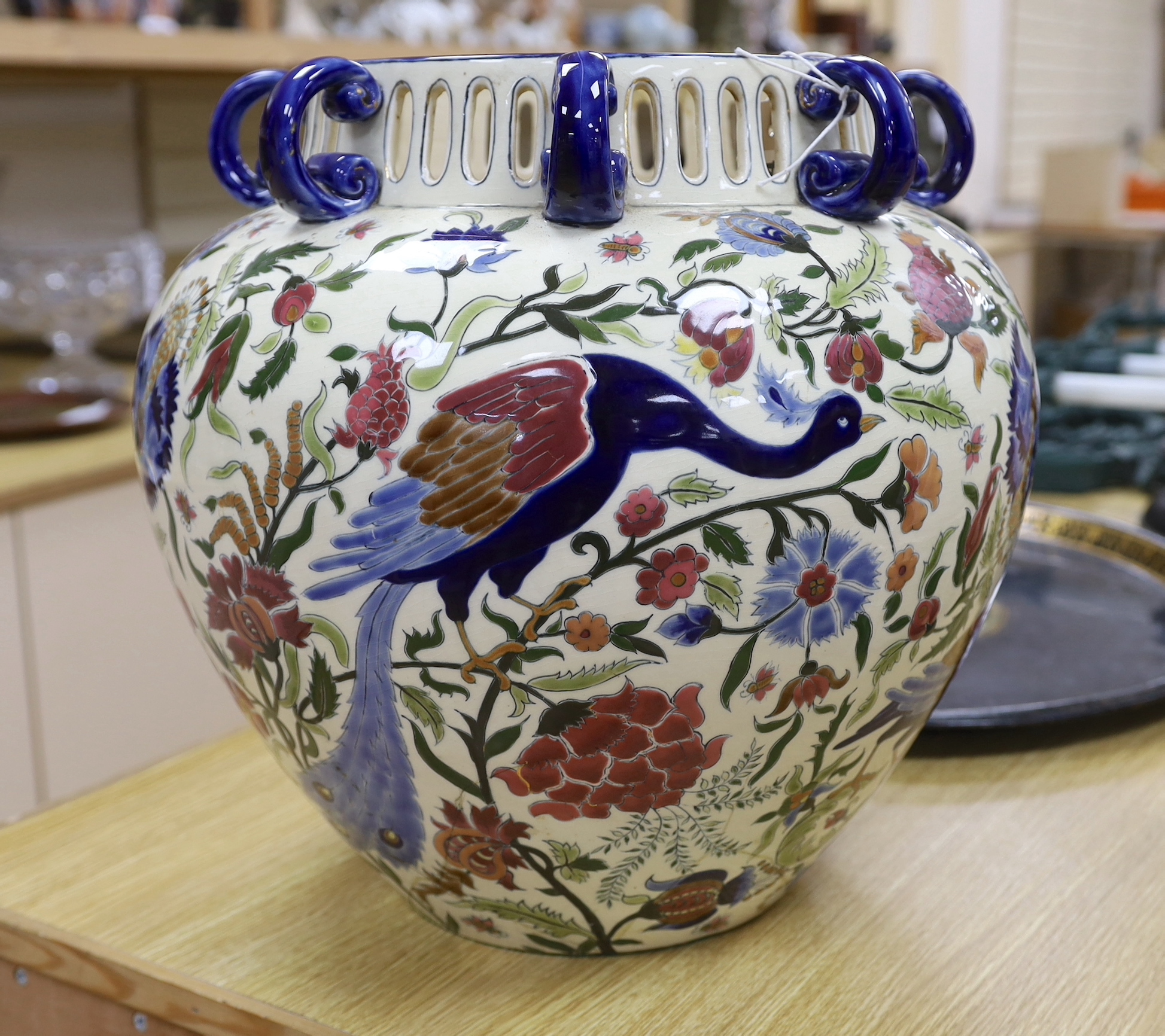 A Zsolnay vase with eight handles, pierced rim and floral decoration with birds, a/f, height 39cm